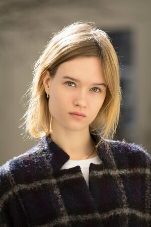 Portrait of a attractive caucasian blonde girl outdoorsの写真素材