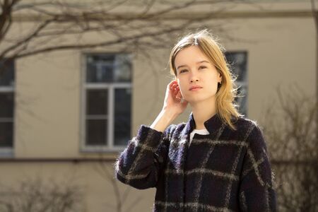 Portrait of a attractive caucasian blonde girl outdoorsの写真素材