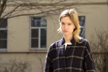 Portrait of a attractive caucasian blonde girl outdoorsの写真素材