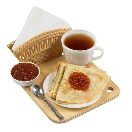 Pancakes with caviar on a wooden board isolated on white backgroundの写真素材