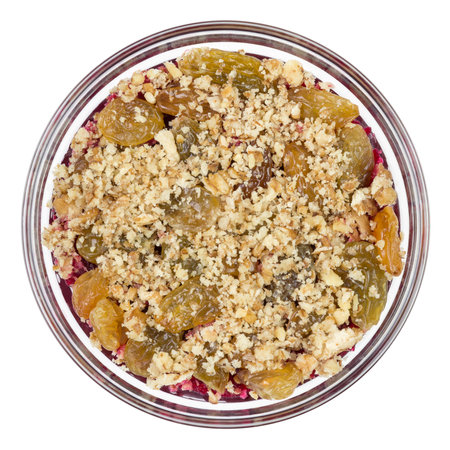 Beetroot salad with raisins and nuts on top isolated on white backgroundの写真素材