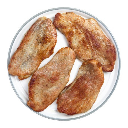 Pork schnitzel on a plate isolated on white background. Top view.の写真素材