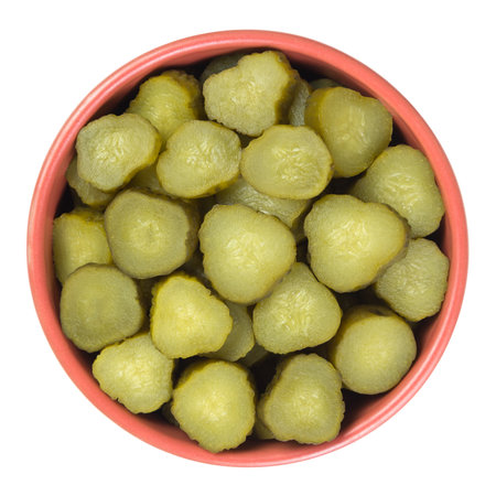 Chopped gherkins in a brown cup isolated on white ba? Kground. Top view.の写真素材