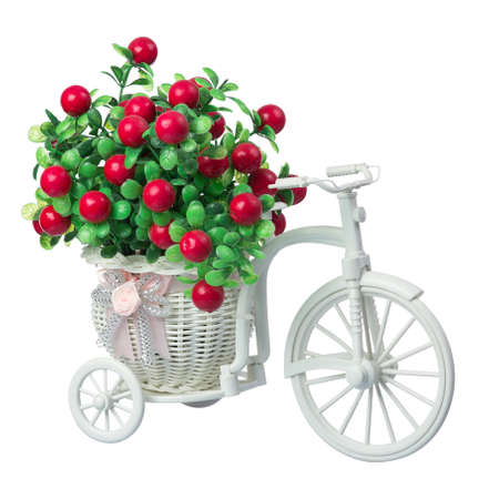Decorative plastic bicycle with decorative flowers isolated on white backgroundの写真素材