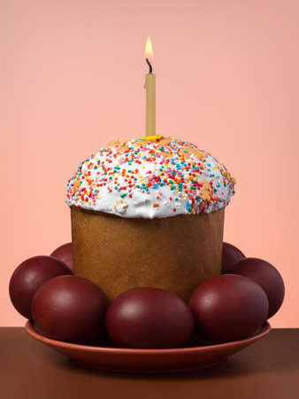 Easter cake with eggs on a plate on beige backgroundの写真素材