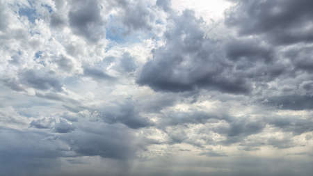 Dramatic dark cumulus sky as a backgroundの写真素材