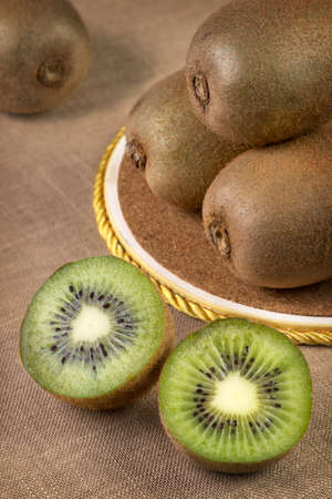 Fresh sliced kiwi on the tableの写真素材
