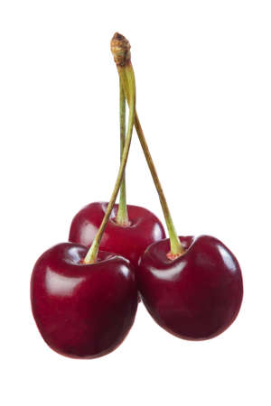 Three sweet cherries isolated on white backgroundの写真素材