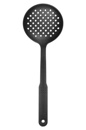 Black plastic kitchen skimmer isolated on white backgroundの写真素材