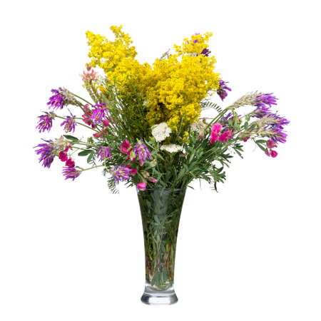 Bouquet of wild flowers in a glass vase isolated on white backgroundの写真素材