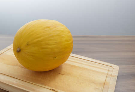 oven-roasted lamb rib with rosemary and olive oil, ready to eat with cherry tomatoes, wooden table and gray backgroundの写真素材