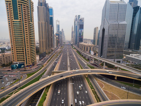 beautiful aerial view of futuristic city landscape with roads, cars, trains, skyscrapers. Dubai, UAEの写真素材