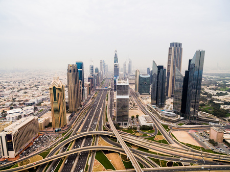 beautiful aerial view of futuristic city landscape with roads, cars and skyscrapers. Dubai, UAEの写真素材