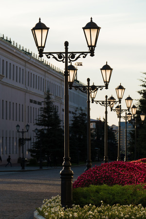 Old iron street lamps on a small streetの写真素材