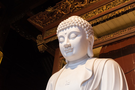 close-up of Buddhist God statue in the ancient longhua temple. China, Shanghaiの写真素材