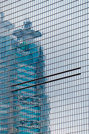 details of the facade of a modern skyscraper made of glass and steel closeup. Shanghai World Financial Centerの写真素材