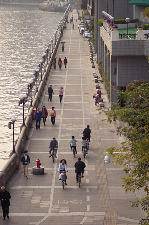 Guangzhou, China - MARCH 15, 2016: People walk at embankment of Zhujiang Riverのeditorial素材