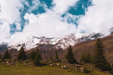 snow-capped mountain peaks of the Altai mountains against the skyの写真素材