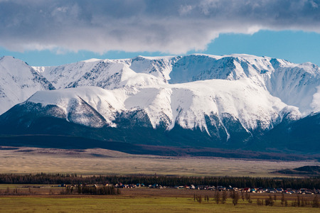 incredible landscape of the steppe area with lakes and trees smoothly turning into mountains with snow-capped peaks. Mountains Of Altaiの写真素材
