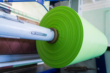 green roll of polyethylene or polypropylene bagsの写真素材