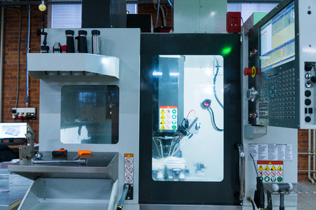 Milling metalworking process. Industrial CNC metal machining by vertical millの写真素材