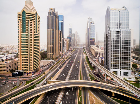 beautiful aerial view of futuristic city landscape with roads, cars and skyscrapers. Dubai, UAEの写真素材