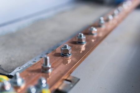 Electric copper bus bars, bolting the live parts of the transformerの写真素材