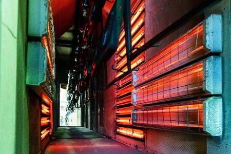 Production workshop for drying painted parts of the oven on a conveyor beltの写真素材