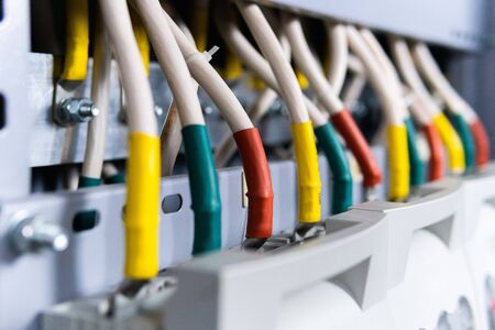 copper busbar, colored wires on metal base. Part of transformerの写真素材