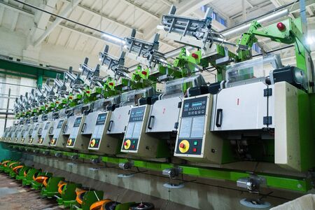 old knitted fabric. Textile factory in spinning production line and a rotating machinery and equipment production companyの写真素材