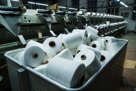 old knitted fabric. Textile factory in spinning production line and a rotating machinery and equipment production companyの写真素材