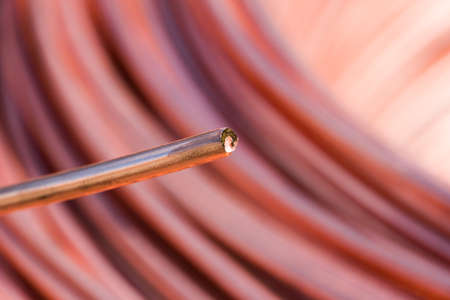 Closeup of Copper Cable being Rolled up in Preparation for Shipment at the Factoryの写真素材