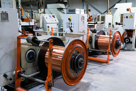 Production of copper wire, bronze cable in reels at factoryの写真素材