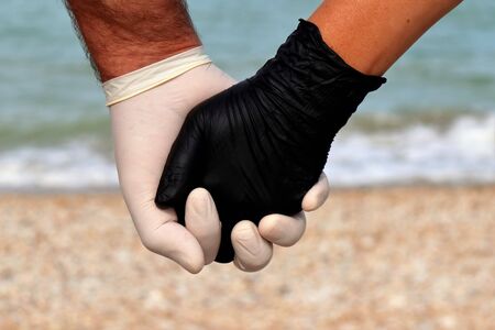 hands protected by covid-19 holidays 2020.の写真素材