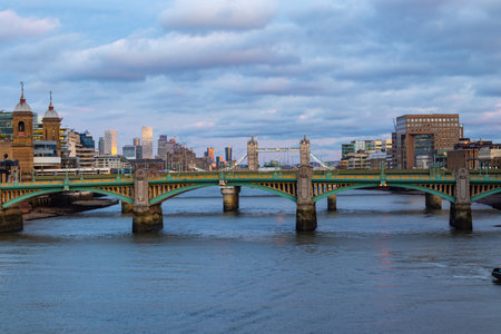 City of London skyline at dusk. Thames river in one of its most important droughts and London Bridgeの写真素材