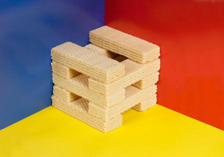 Pop art still life. Sweet wafers on multicolor background.の写真素材