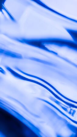Abstract striped blue background with light and dark stripes and stains...の写真素材