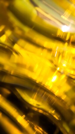 Orange and yellow background of abstract warm curves, hot wave, continuous lines with neon glow. template for card or banner. can be used for background or wallpaperの写真素材