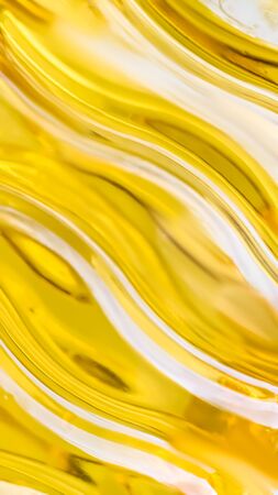 Orange and yellow background of abstract warm curves, hot wave, continuous lines with neon glow. template for card or banner. can be used for background or wallpaperの写真素材