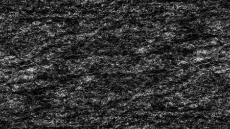 Dark abstract textured background with a texture of natural stone with black and white spots, natural granite.の写真素材