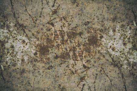 Vintage old abstract black and white background with brown sepia tone, light and dark spots, stains and cracks on the gray wall...の写真素材