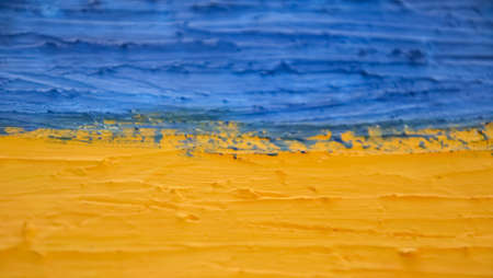 Ukraine Flag. abstract yellow-blue background, selective focus.の写真素材