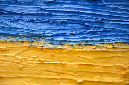 Ukraine Flag. abstract yellow-blue background, selective focus.の写真素材