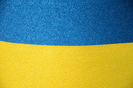 Ukrainian flag on blue and yellow background. Abstract background.の写真素材