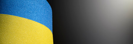 Ukrainian flag on black background. Horizontal banner with copy spaceの写真素材