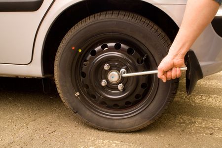 setting of wheel on a carの写真素材