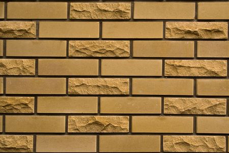 yellow brick wall of city houseの写真素材
