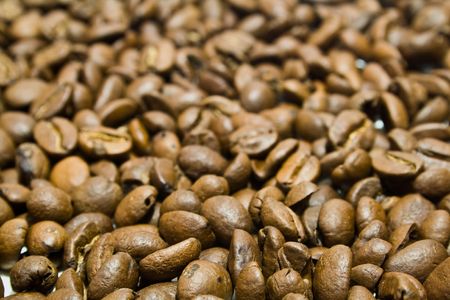 a large heap of coffee is in grainsの写真素材