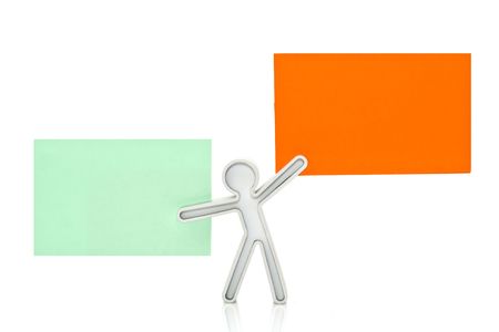 figure with an orange and green business card on a white backgroundの写真素材
