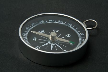 metallic compass on a black backgroundの写真素材